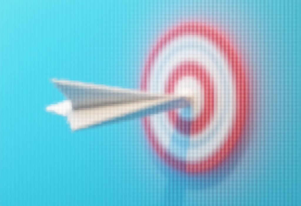 Dostarczalność newsletterów i maili – jak działa i jak ją poprawić? dostarczalność newsletterów - papierowy samolot wbity w tarczę